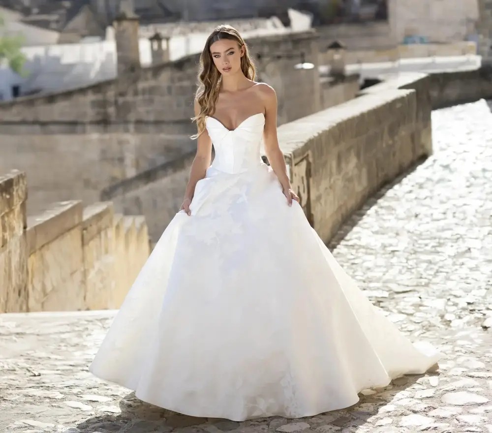 Model wearing a white Anne Barge Gown